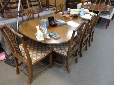 An old mahogany D end dining table having one leaf, on tripod supports, a set of 8 dining chairs wit