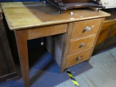 An old pine pedestal desk having three drawers