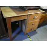 An old pine pedestal desk having three drawers