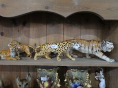 A Beswick Leopard and three other wild cats