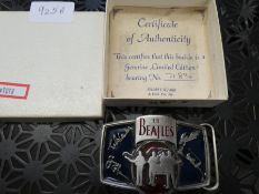 A Beatles limited edition belt buckle with certificate, circa 1995
