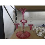 A Victorian Cranberry glass epergne with 3 trumpets and 2 baskets, 49cm
