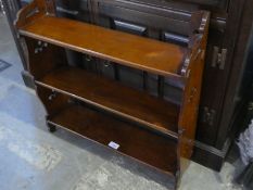 A Victorian mahogany hanging wall shelf with pierced decoration