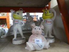 Two cast iron Esso advertising figures and Wade pig