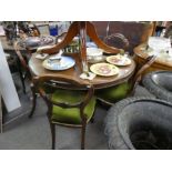 A Victorian mahogany circular dining table on carved tripod base with set of five Victorian balloon