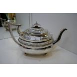 A very nice Georgian large silver teapot with gadrooned decoration and knop, on four ball feet. Hall