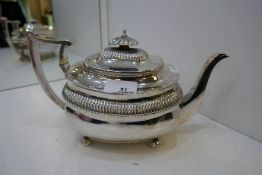 A very nice Georgian large silver teapot with gadrooned decoration and knop, on four ball feet. Hall