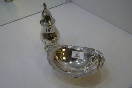 A silver decorative sugar sifter on a raised pedestal foot. Birmingham 1938, Adie Brothers Ltd. Also