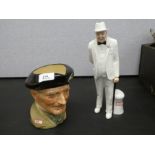 A Royal Doulton Winston Churchill figure, HN3057 and a Monty character jug, D6202