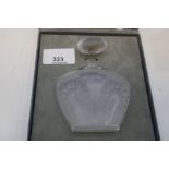 A Lalique Singapore perfume bottle and one other decorated faces with partial contents, both boxed