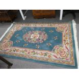 A modern Chinese rug, 204 x 140 cms, and one other small rug