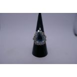 Beautiful white metal dress ring with pear shaped aquamarine surrounded by 16 approx 0.10 brilliant