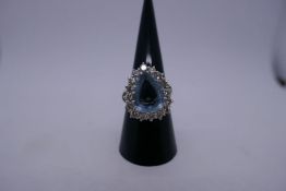 Beautiful white metal dress ring with pear shaped aquamarine surrounded by 16 approx 0.10 brilliant