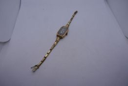 Vintage 9ct yellow gold ladies wristwatch, case marked 9ct, DS on plated strap, 14.2g gross weight.