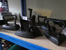 Collection of cast irons, doorstops and a shoe last