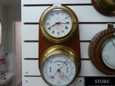 A twin mounted clock and barometer on wooden plaque