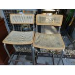 Two aluminium framed cane seat bar seats