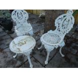 Heavy cast metal white painted garden chairs and matching wine table