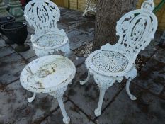 Heavy cast metal white painted garden chairs and matching wine table