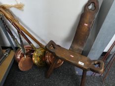 Arts and crafts style three legged table and a quantity of bedpans