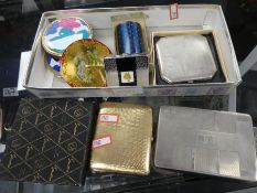 A silver engine turned compact , an 800 silver cigarette case, a yellow metal cigarette case and sun