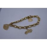 14K yellow gold charm bracelet hung with 3 charms 'Aunt' 'Sister' and 'Daughter' marked 14K 7.6g