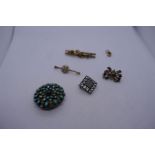 Collection of brooches to include: Yellow metal backed paste set mourning brooch with inscription