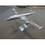 A polished Aluminum model of a Lockheed Constellation by Andrew Martin, 52cm long