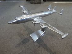 A polished Aluminum model of a Lockheed Constellation by Andrew Martin, 52cm long