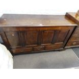 An charming antique Oak Mule chest having paneled front with three drawers below (139cm).