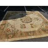 An old woolen carpet having central medallion with floral motifs 356x314cm