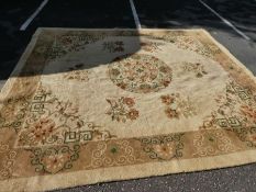 An old woolen carpet having central medallion with floral motifs 356x314cm