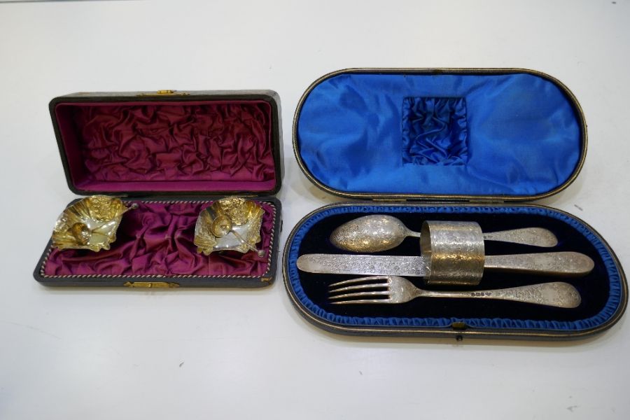 A gorgeous cased set of floriated engraved silver knife, fork, spoon and napkin ring. Very decorativ