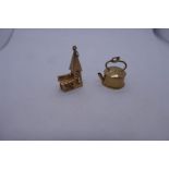 Two 9ct yellow gold charms, one of a kettle and the other a church, 3cm, both marked 375, approx. 7.