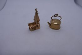 Two 9ct yellow gold charms, one of a kettle and the other a church, 3cm, both marked 375, approx. 7.