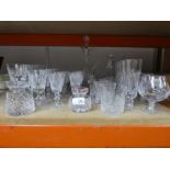A selection of cut glass including brandy tumblers, champagne, etc and a couple of decanters