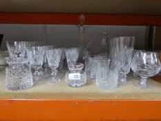 A selection of cut glass including brandy tumblers, champagne, etc and a couple of decanters