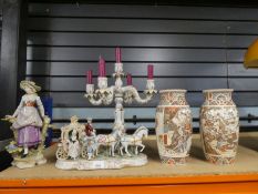 Three pieces of Continental china figures, one depicting horse and carriage, girl and candelabra