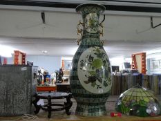 Large oriental green ground vase approx 90cm and wooden stand