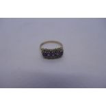 Three contemporary 9ct yellow gold dress ring, one an amethyst cluster ring, an emerald and diamond