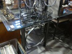 A modern glass oblong kitchen table on iron tubular base and a set of 6 chairs, wine rack,