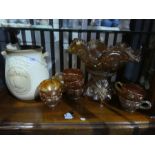 A Carnival glass punch bowl with mugs and a Rumtopf lidded jar
