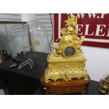 An antique French Ormolu mantle clock of lady seated on a boat. inlaid wooden musical box base, dome