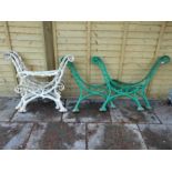 Set of two heavy Victorian style cast iron bench supports, one painted green, the other white