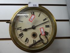 A brass mounted clock with key