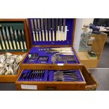 A late Victorian oak canteen of silver plated cutlery by G Plan and Co, Bristol (at least two knives