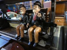 2 Modern figures of Laurel and Hardy on metal stand