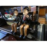 2 Modern figures of Laurel and Hardy on metal stand