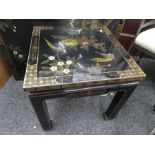 Black laquered oriental design square table, decorated with birds and flowers and matching coffee ta