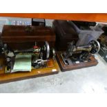 Two vintage hand cranked Sewing machines, one a Vickers the other a Singer